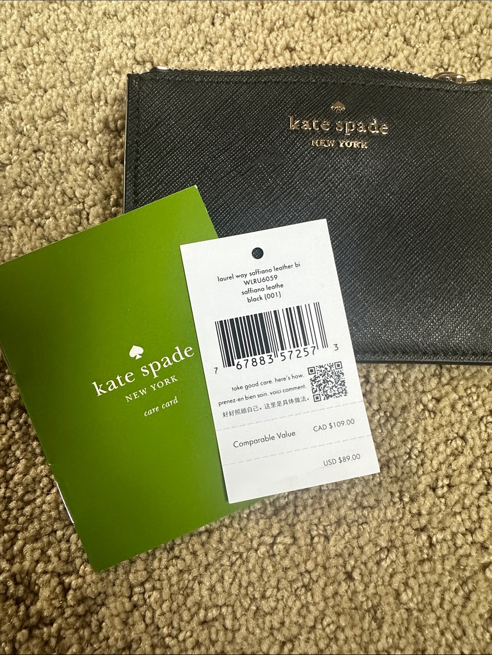 kate spade black saffiano leather zip wristlet with gold logo NEW